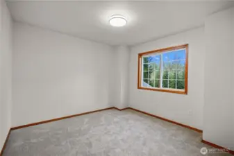 Spacious 3rd bedroom with new paint, new carpet and lots of natural light.