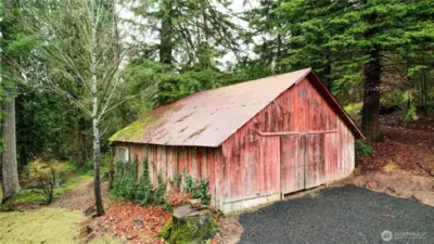 New black crushed rock driveway surfacing to barn and well. New 200' deep well with submersible pump.  Rustic barn offering a blank canvas for creative updates, storage or workshop space.