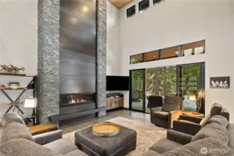 Floor to ceiling stone/metal fireplace