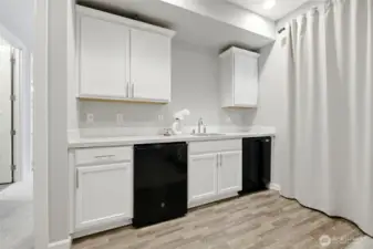 Kitchen in main floor apartment with separate entrance dishwasher, mini fridge, sink & room for microwave, hot plate