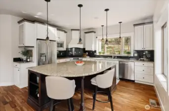 French country kitchen with tons of counter space and room for 4 stools.