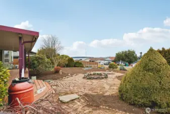 Rain barrel catchment system off the covered front porch with views of beautiful Port Susan.