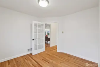 View looking out towards the hall from the den.