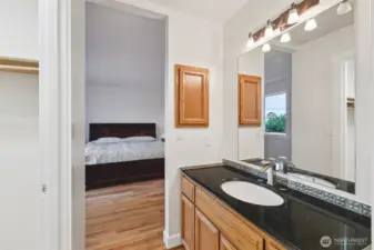 Looking towards the primary bedroom from the bathroom.