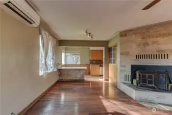 Note the ductless mini split. Living room flows in to eating area.