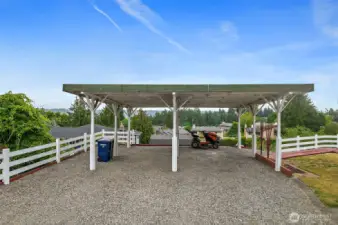 Large driveway with plenty of parking including a RV.