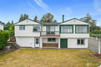 View of the back of the house. Do you see the large Green Door?  There is a shop in there!