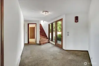 Beautiful exposed polished aggregate entry. Interior stairs up to the MIL.