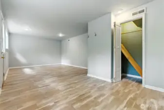 Basement closet has hidden door housing the water heater