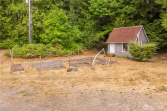 Artists Cottage with raised garden beds out front, Rv hook ups to the rt