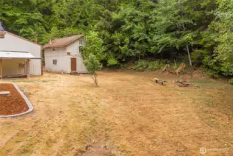 The Cave behind garage, fruit trees