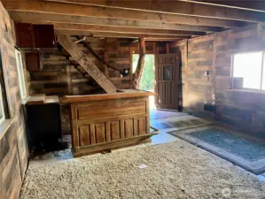 Inside 'cave' with bar and wood stove off to right (just outside of picture)