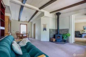 Family/flex room with a pleasing wood stove + a formal dining space w/built-in to show off your prettiest dinnerware.