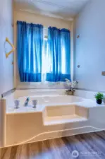 Primary boasts a deep soak tub ~ shower is separate {not photo'd}.