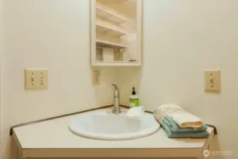 Upgraded Moen faucets & lighting throughout.