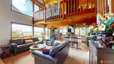Greatroom with lake views, and seamless flow to the dining and kitchen areas.