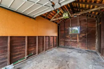 The interior of the garage is ready for your car, lawn care items, or storage.