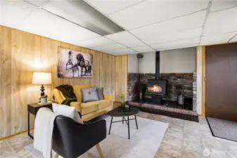 Downstairs living area with wood burning stove (chimney professionally cleaned February 2026)
