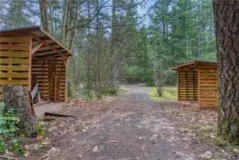Wood sheds to keep your firewood dry and this is driveway heading towards back gate.