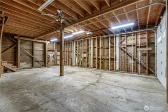 Garage side of barn with new overhead door (2023) Keypad and remotes to garage door and lots of storage upstairs.