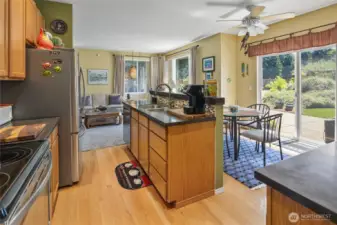 Quartz countertops updated stainless steel appliances and real oak cabinets plus island to provide even more storage.