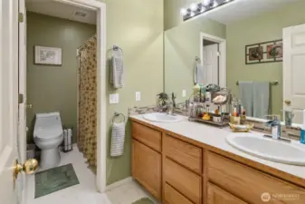 Full guest bathroom and dual sink vanity.