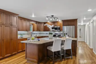 Gorgeous kitchen remodel is a chef's dream. Granite counters, stainless steel appliances, double oven, and loads of cupboard and counter space.