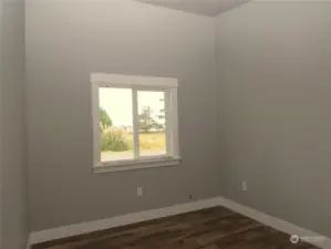 THE NORTH PRIMARY BEDROOM HAS 10 FT CEILINGS AND CONTINUES WITH LUXURY VINYL PLANK FLOORING!