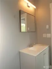 BATH HAS A VANITY WITH QUARTZ COUNTER TOP!