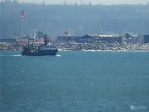 WATCH SHIPS GO IN AND OUT OF THE HARBOR AT THE JETTY!