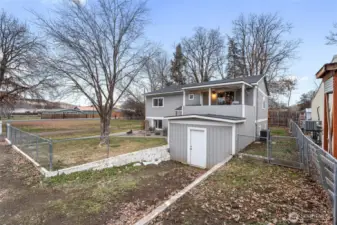 Front exterior with side shed