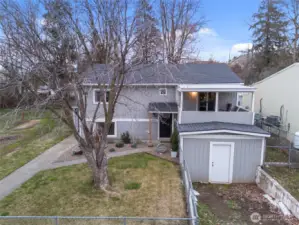 Front exterior with side shed