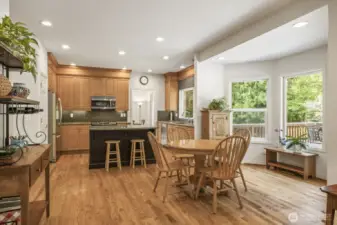 The informal dining area is conveniently in between the kitchen and family room and has a door that leads to the deck and backyard.