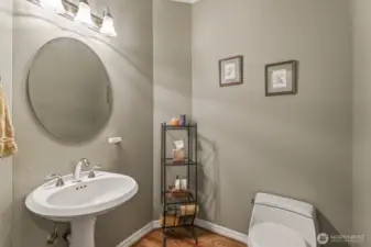 The main floor is completed with the guest ½ bath and laundry room with lots of cabinets and a utility sink.