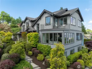 Perched on a quiet street in Leschi, this move-in ready home offers incredible east-facing views of Lake WA, the Cascades & Mt. Baker.