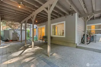 Plenty of room to BBQ, entertain and extra covered storage! Storage shed stays.