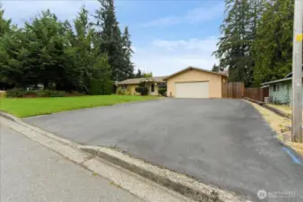 Fabulous level yard with sprinkler system and plenty of parking.