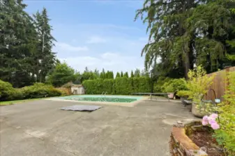 The cover in the foreground hides a two person in ground hot tub.