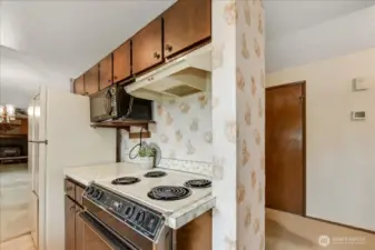 Functional as is, but it wouldn't be difficult to open this up and install an island with built in stove.