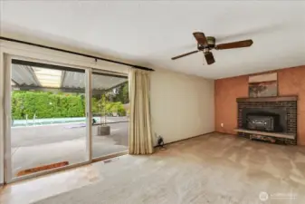 Rec Room with wood burning fireplace insert.