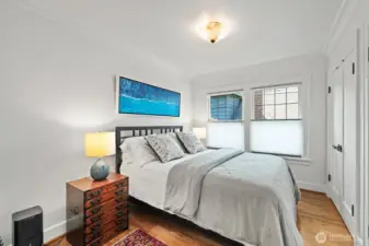 Bedroom with double closets (one houses the W/D) and top down blinds.