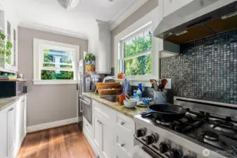 Unit 1 kitchen with SS appliances, including a gas stove.
