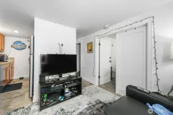 Basement unit living room and kitchen on the left.