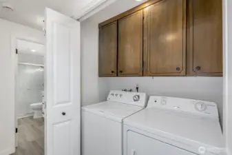 Utility area with full size washer / dryer.