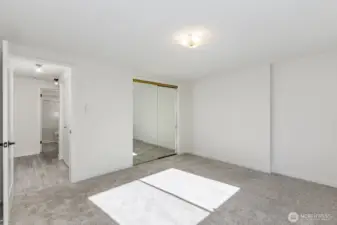 view of bedroom with door to bath to left.
