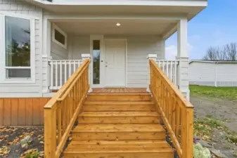 Charming covered porch — a perfect spot to greet guests or enjoy your morning coffee.