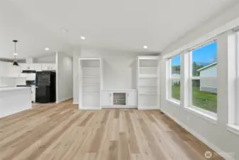 The living area features a clean, modern built-in entertainment center.