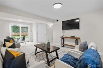 The lower-level rec room continues the home’s cohesive design with new carpet installed in 2026 throughout the lower floor in the same soft, natural tone carried throughout the upper level. Fresh paint keeps the palette light and consistent, allowing the space to feel connected rather than separate.