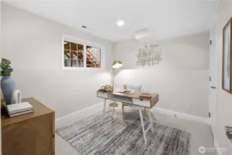 This fourth bedroom carries the same cohesive palette found throughout the home, with fresh paint in soft, welcoming tones and new carpet in a versatile natural shade. The color story keeps everything feeling calm and connected from room to room.  A wide, multi-paned window brings in natural light, adding brightnes and giving the space an open, comfortable presence throughout the day.   Updated recessed lighting casts an even, gentle glow across the room, keeping evenings bright and welcoming while maintaining the same understated style found throughout the home.