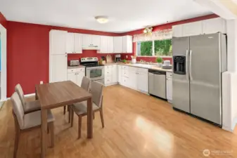 Kitchen with lots of room for a table -- Virtually staged.